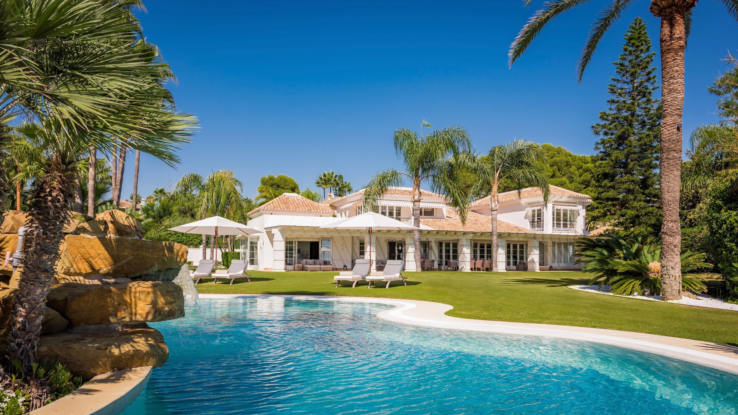 Villa Tesoro Mediterranean villa exterior with terracotta roof and lagoon pool, Marbella, Spain