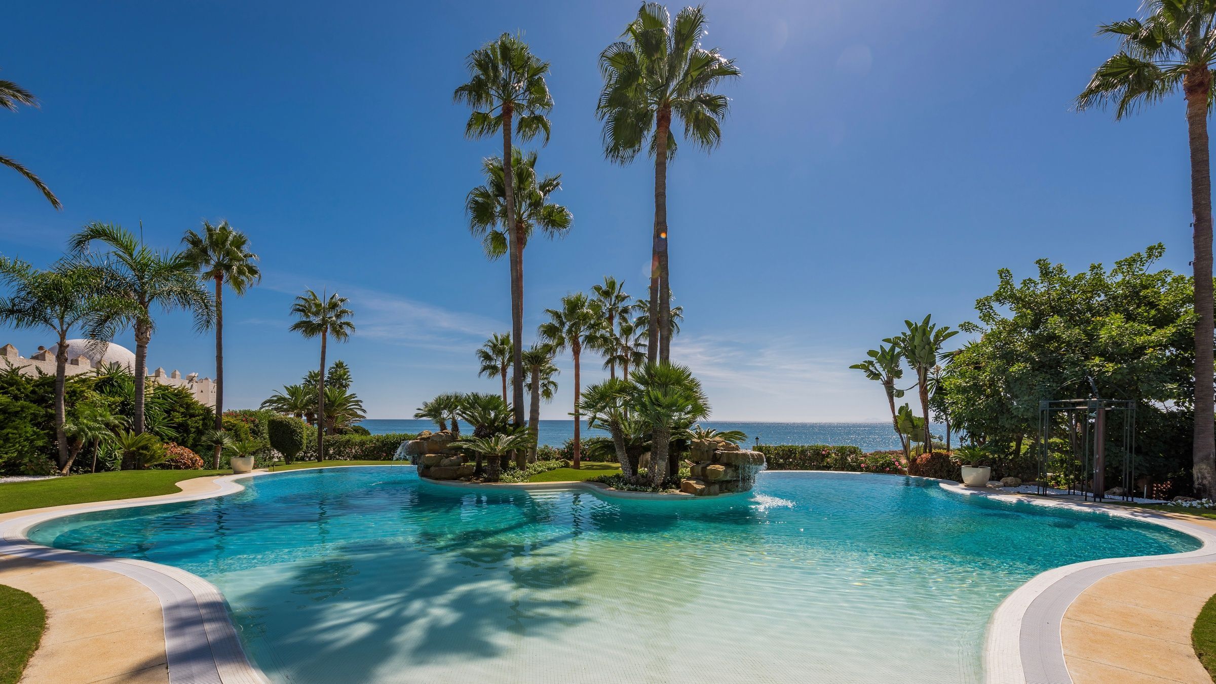 Villa Tesoro curved lagoon pool with tropical landscaping, Marbella, Andalusia, Spain
