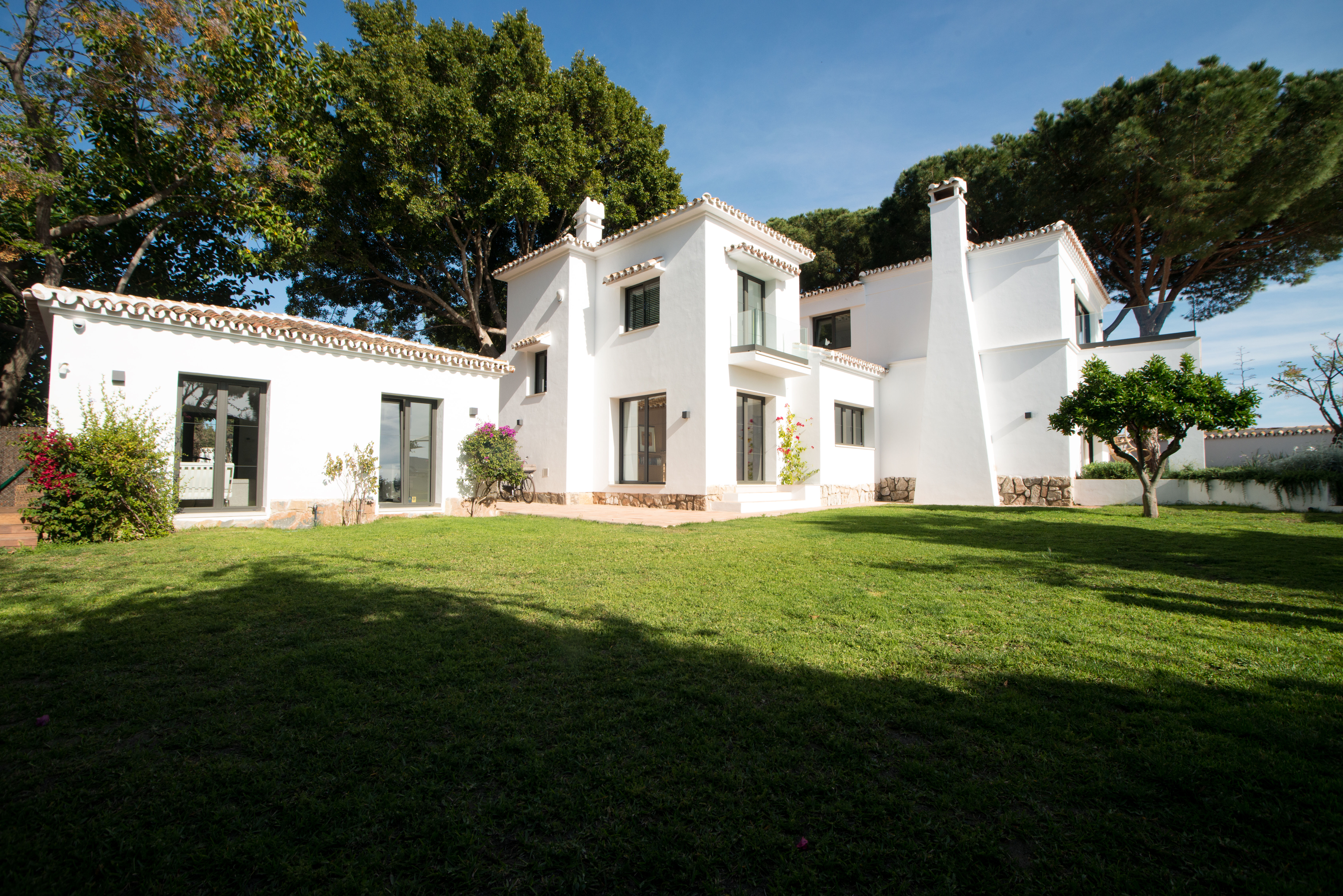 Villa Cecilia kitchen detail with floating shelves and garden access, Marbella, Costa del Sol, Spain
