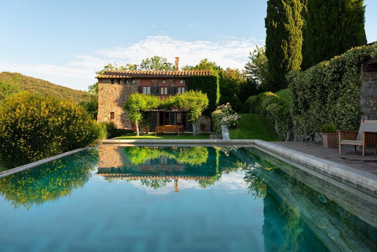 Villa Fortaleza infinity pool with rustic stone architecture, Province of Grosseto, Tuscany, Italy