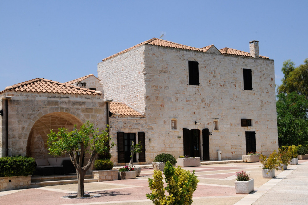 Sublimia villa front facade with stone archway and courtyard, Ceglie Messapica, Apulia, Italy