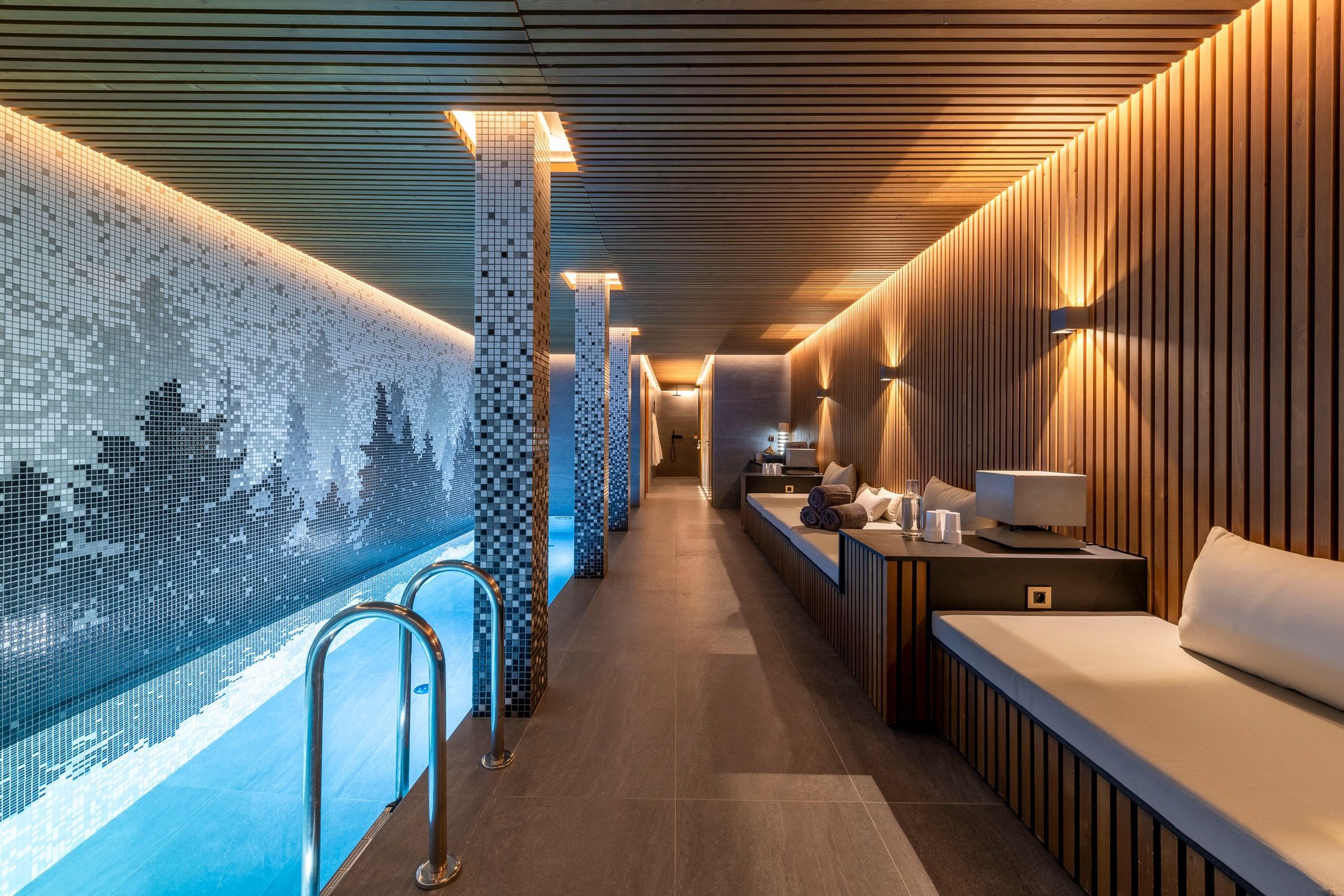 Chalet Ascension indoor spa pool with blue mosaic art, Courchevel 1650, French Alps, France